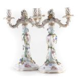 Pair of Dresden candleabras, painted with figures in garden scenes, applied with flora, mid 19th