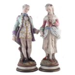Pair of French coloured bisque figures, modelled as a lady and gentleman dressed in floral