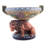 Amphora table centre piece with floral decorated twin handled bowl, supported by a lion on pedestal,