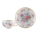 Derby tea cup and saucer circa 1800, finely painted with a flower sprays, with unusual moulded