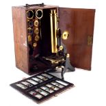 Swift & Son, Tottenham Court Road, London, lacquered brass and blued steel monocular microscope with