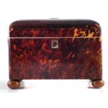 Tortoiseshell tea caddy, the domed top divided by white metal spacers, revealing two division