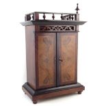 Mid 19th century continental table top polyphone type disc player, playing on double comb all