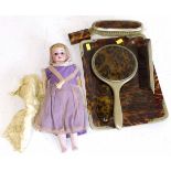 19th century porcelain headed doll, faux tortoiseshell dressing table ware and small box.