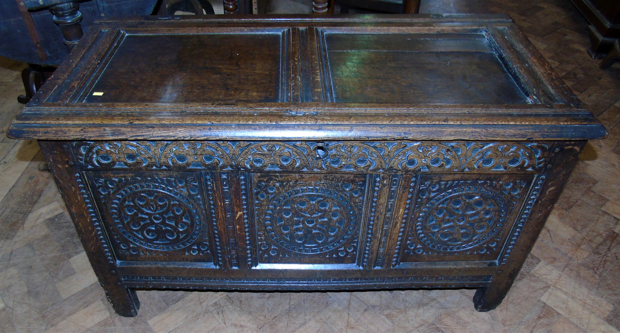 George III oak coffer with carved panel front. Condition reports are not available for our Interiors