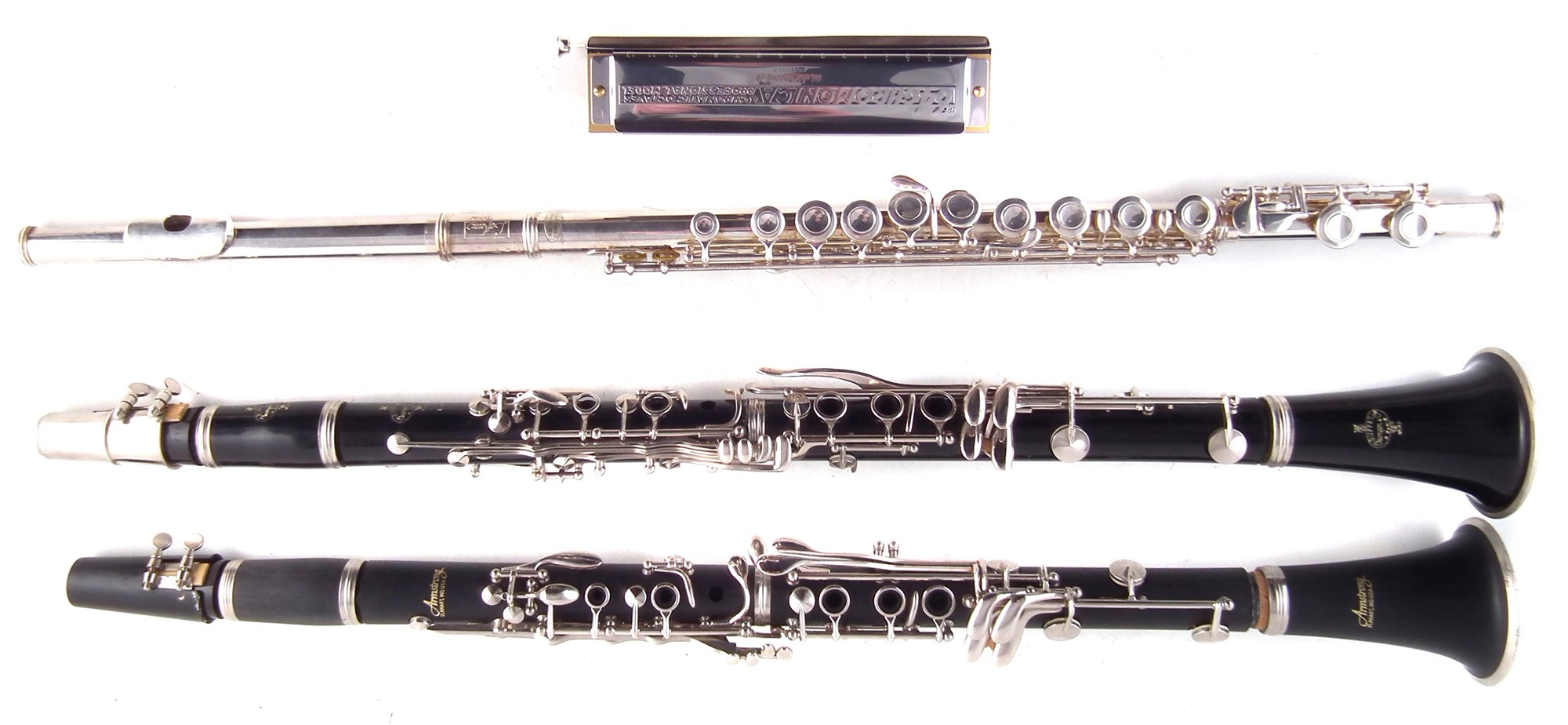 Armstrong clarinet, Buffet clarinet, Lafleur flute, Hohner 64 Chromonica , all with cases.