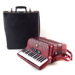 Guerrini piano accordion, with case which measures 43cm wide