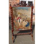 Victorian walnut fire screen enclosing tapestry of Moses in the Bullrushes, standing on barley-twist