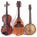 Three instruments to include a violin with two piece back measuring 36cm with case and bow, also a