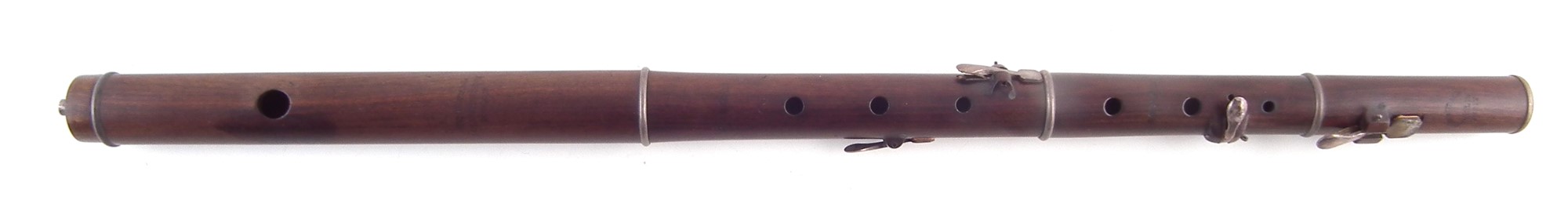 Four key flute by Geo. Rudall , (in F A=440) of Cocus wood, stamped with 5 Clements Inn London