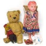 Early 20th century celluloid doll and two teddy bears. Condition reports are not available for our