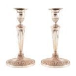 Pair of Sheffield plated Regency style candlesticks. Condition reports are not available for our