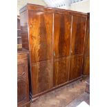 19th century style three door mahogany wardrobe on ogee feet. Condition reports are not available