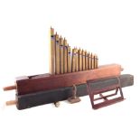 Fourteen modern pipes for a 15th Century style portative organ , also two organ pipes rescued from