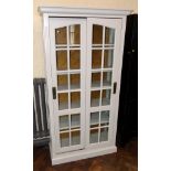 John Lewis two door glazed cupboard, 94cm wide. Condition reports are not available for our