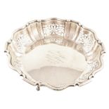 Silver presentation dish , Chippendale border with pierced floral decoration on 3 paw feet,