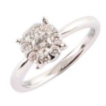 Diamond cluster 18ct white gold ring , central round brilliant cut diamond with a surround of 8