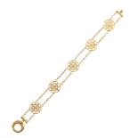 18ct gold 5-link bracelet , the 5 round wheel openwork links with 4 petal designs to each, 2-row