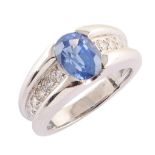 Sapphire and diamond 18ct white gold ring , the oval mixed cut blue sapphire measuring approx. 8mm x