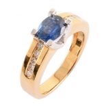 Sapphire single-stone 18ct gold ring with diamond set shoulders , oval mixed cut blue sapphire