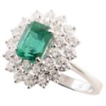 Emerald and diamond 3-tier oval cluster platinum ring , the central emerald cut emerald