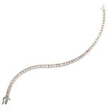 18ct white gold diamond set line bracelet , channel set with tapered baguette cut diamonds, total