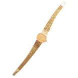 Ladie's 18ct gold Omega De Ville bracelet watch , the oval champagne coloured striped dial to yellow