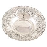 Continental silver circular centre dish , fruiting vine pierced pattern border to plain well,