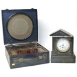 Early 20th century portable radio in suitcase style fibre case and polished slate 8-day mantle clock