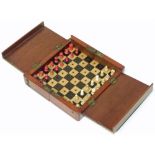 Victorian mahogany cased travelling chess set with bone playing pieces. Condition reports are not