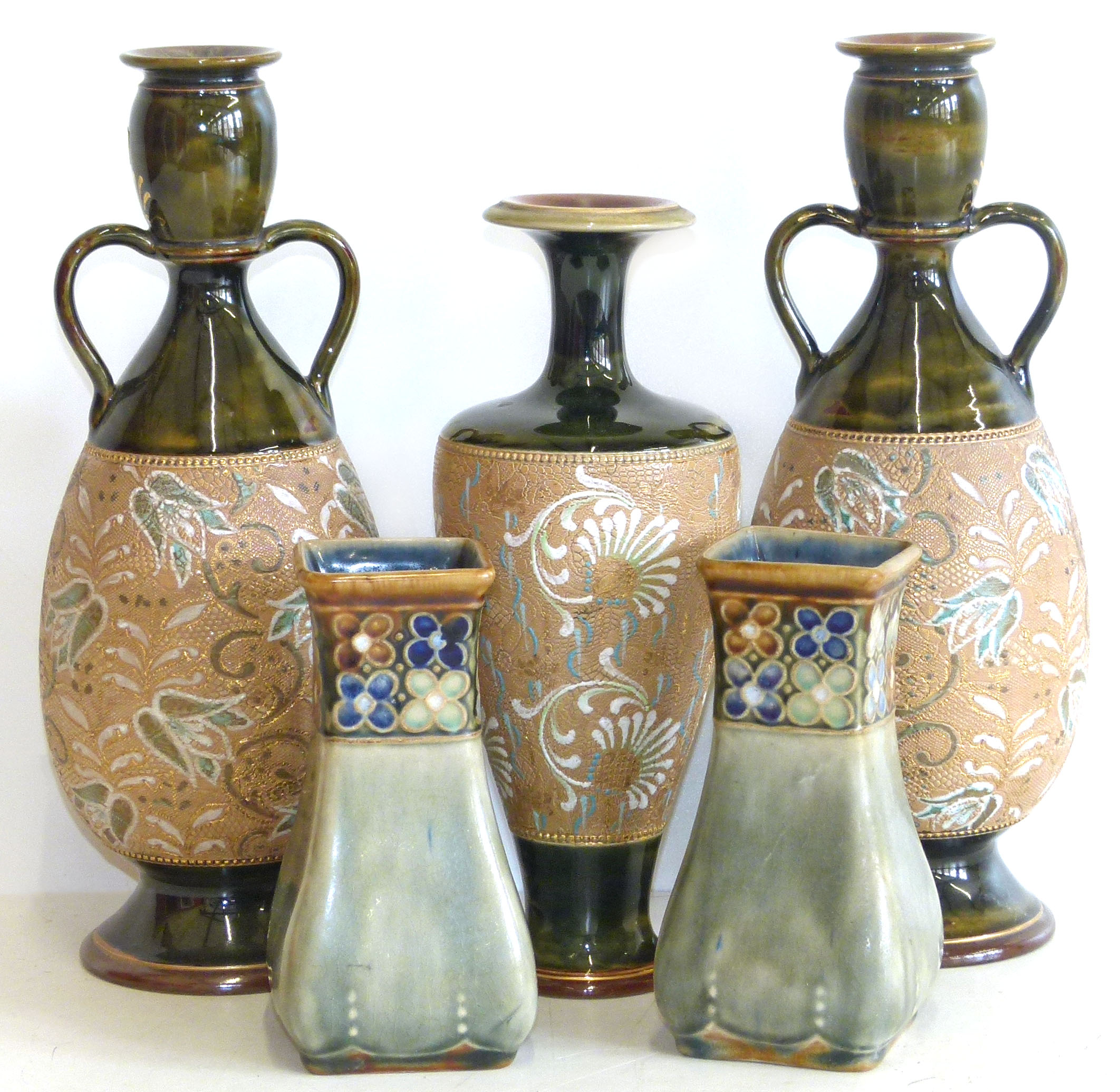 Two pairs of Doulton Lambeth vases and one othwe Condition reports are not available for Interiors