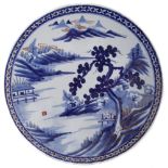 Japanese Charger, painted with a lake scene in underglaze blue, 45cm diameter Condition reports