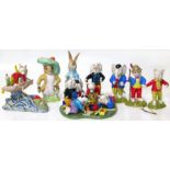 Six Royal Doulton Rupert the Bear figures also two large size Beswick Beatrix Potter figures