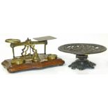 Set of Victorian brass postal scales and a cast iron taza. Condition reports are not available for