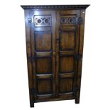 Reproduction oak two door panelled wardrobe, 102cm wide. Condition reports are not available for