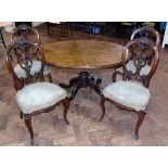 Four Victorian walnut single chairs with carved and moulded oval backs, also a Victorian loo