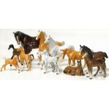 A collection of Beswick horse and foal models, five in brown, three in grey and four palomino (one