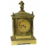 19th century French mantle clock 8-day movement striking on a single gong, brass case with cherub