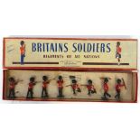 Boxed Britains Coldstream Guards, seven in various firing positions, one using binoculars. Condition