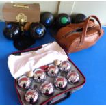 A cased set if 8 boules, a pair of cased "Viralite" size 1 bowls and one other, and a pair of