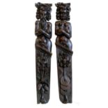 A pair of 19th century stained oak term pilaster figures