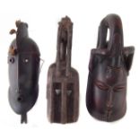 Three African Dogon tribal masks, the largest measures 42cm high