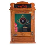 The Smithy penny slot flick machine reproduction, with four keys, 68.5cm high The machine appears to