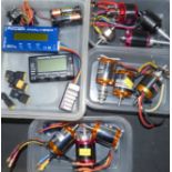 Ten 12 volt model aeroplane motors and battery checkers.