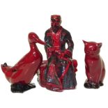 Royal Doulton Flambe Carpet Seller , a model of a cat and a mallard. Condition reports are not