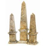 A pair of 20th century granite obelisk columns 34cm high and one other 48cm high Condition reports