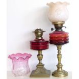 Two Victorian oil lamps with ruby glass bowls. Condition reports are not available for Interiors