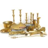 Three pairs of brass candlesticks, brass shoe horns, chambers pot, dishes and saucepan. Condition