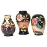 Three Moorcroft vases, 1st quality, the largest stands 16cm high Condition reports are not available