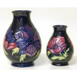 Two Moorcroft vases decorated with Anemone pattern, 1st quality, the largest stands 19cm high